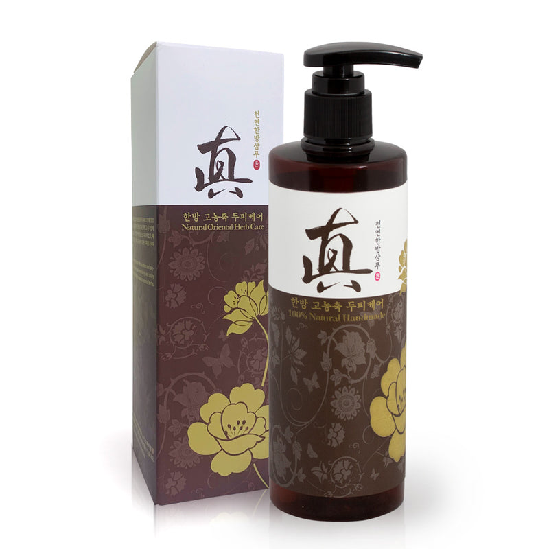 Bottle and box of a natural hair care product with floral designs on a white background