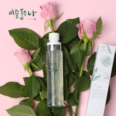 Skincare product with roses and green leaves on a pink background