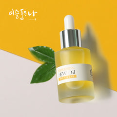 Yellow signal dew oil dropper bottle with a white cap on a yellow background