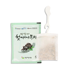 Hovenia Dulcis Tea package with a white hook on tea bag on a white background