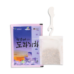 Balloon flower tea  bag packaging with a white spoon on a white background