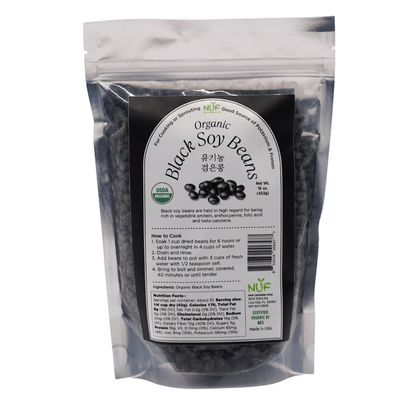 Package of organic black soy beans with a label on a white background