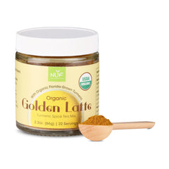 Jar of Organic Golden Latte spice mix with a wooden spoon on a white background