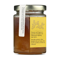 Jar of New Universe Food Ginger Infused Honey with description on yellow lable