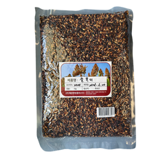 Packaged black rice with a label on a white background