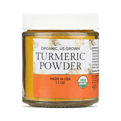Jar of organic turmeric powder with a white label on a white background