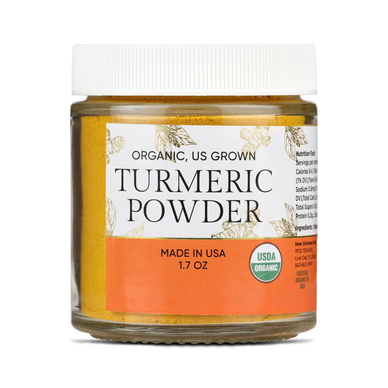 Jar of organic turmeric powder with a white label on a white background