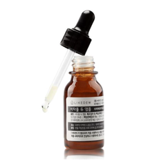 Brown serum bottle with dropper on a white background