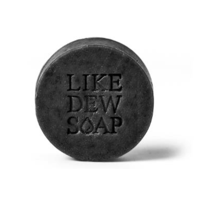 Black soap bar with 'LIKE DEW SOAP' text on a white background