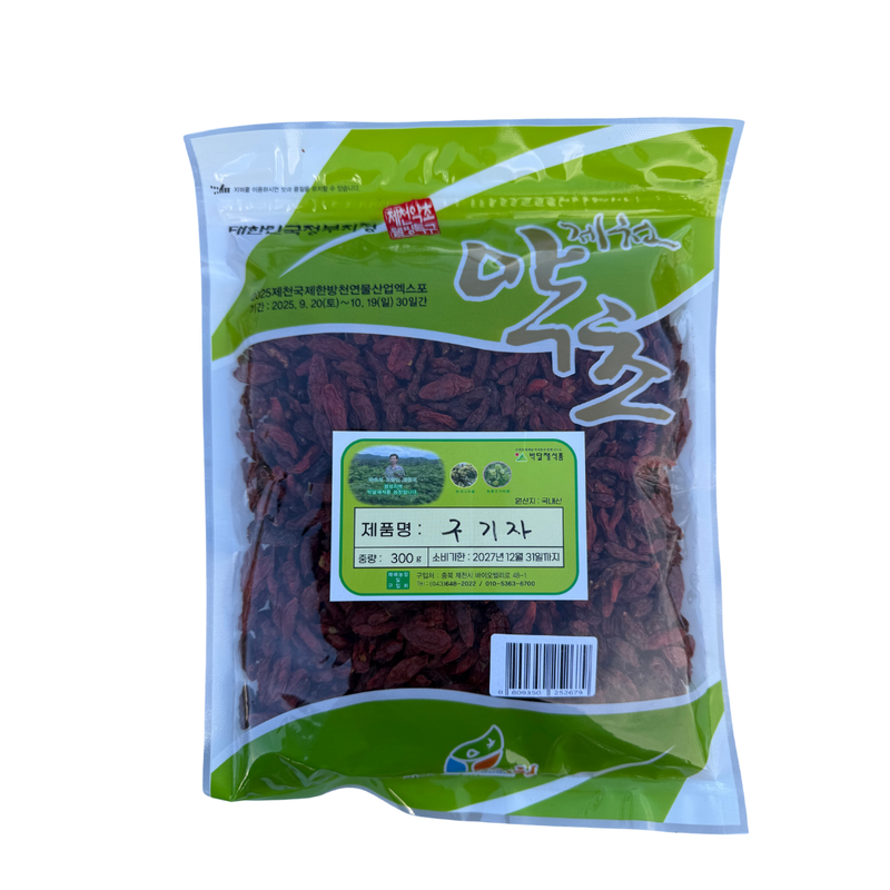 Packaged goji berries with green and white label on a white background