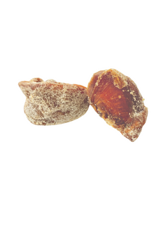 Two dried persimmons pieces with natural sugar crystals on a white background