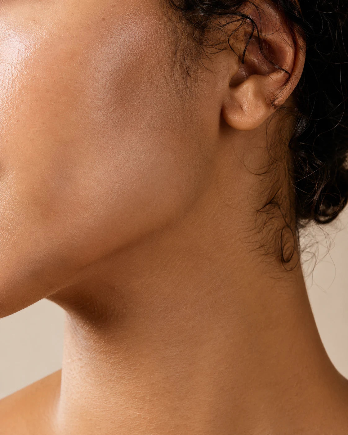 BT Radiant Renewal Cream being applied along the jawline