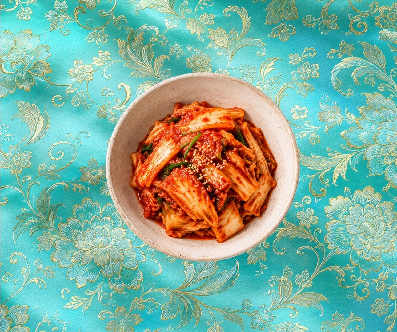 Bowl of NUF Classic Kimchi on turquoise brocade