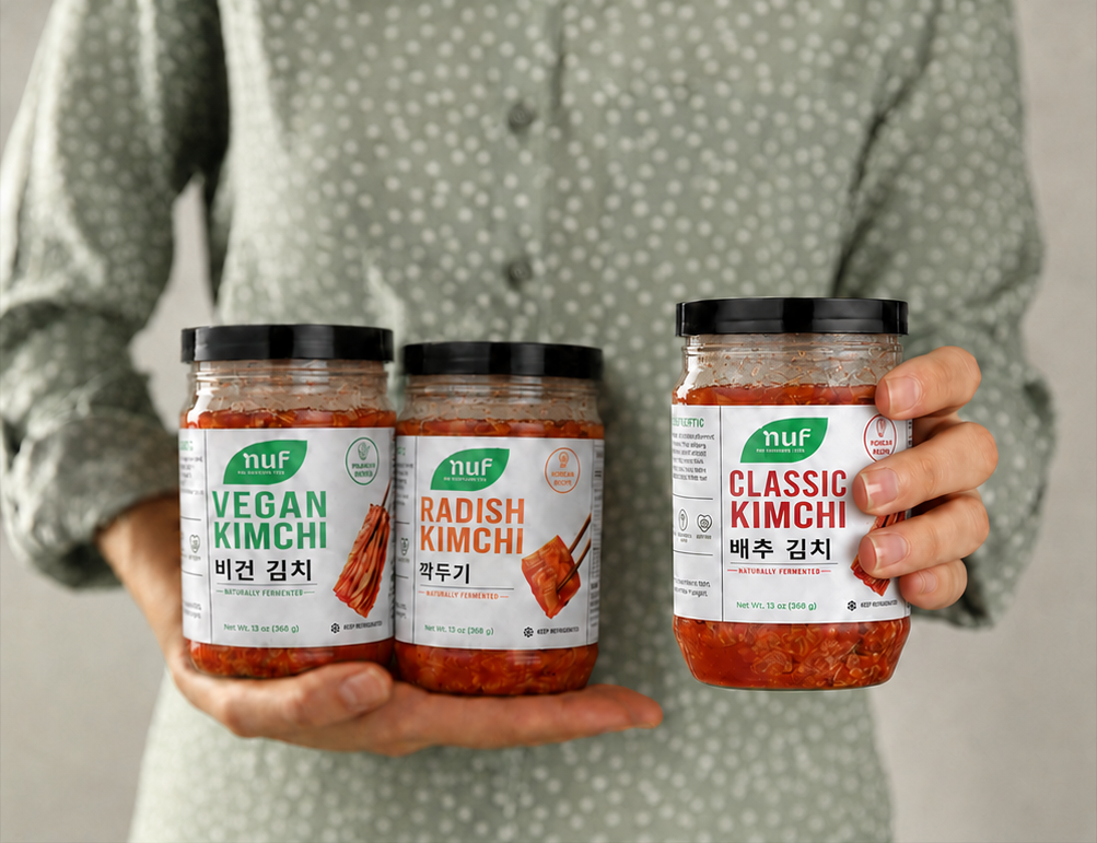 Woman holding Classic, Vegan, and Radish NUF Kimchi jars